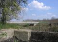A vasúti Kapos-híd északi hídfőjéről nézünk át a 66-os főútvonal Kapos-hídjára